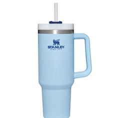 the stanley travel mug is light blue and has a straw in it's mouth