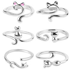 four different rings with cats on them and one has a pink cat in the middle