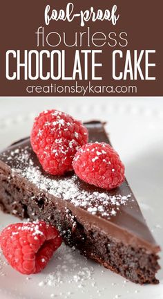 a piece of chocolate cake with raspberries and powdered sugar on the top