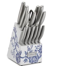 a set of kitchen knives in a blue and white holder