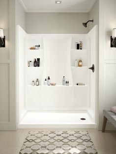 a bathroom with white walls and shelves filled with personal care items on the shelf above the bathtub