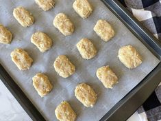 doughnuts are on a baking sheet ready to be baked in the oven for consumption