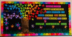 a bulletin board with colorful paper butterflies on it and the words thank you dear teachers for giving us the roots to grow and the wings to fly