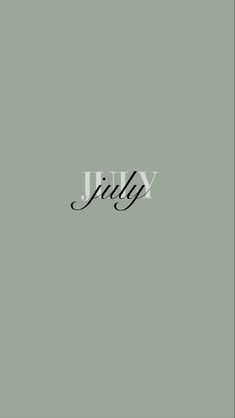 the word july written in black ink on a gray background