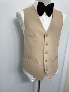 Goodmorning! This is a Vintage 1960s era  beige cream wool pleated hip pocket suit vest/ waistcoat. This suit vest waistcoat features five-button front closure and two front and side hip jetted pockets.. This is a great find and superb find for vintage enthusiast lovers. Excellent great fi Estimated size: 40 : Please see measurement below , for best fit compare measurement with similar vest waistcoat or item. Armpit to Armpit: 21" Front Length: 24.50" Condition: For its age , this suit vest is i Wedding Vest, Vest Waistcoat, Vintage Suits, Dinner Wedding, Mens Vests, Black Stains, Vest Outfits, Suit Vest, Vintage Wool