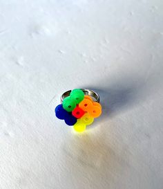 These rings are great for kids. They are colorful and playful.  They come in a gift bag. (Colors vary. If you would like a specific color, please send me a message). They are made of plastic beads. The colors green, blue, orange, yellow and pink. Playful Multicolor Rings For Gifts, Unique Rainbow Colored Rings As Gift, Unique Rainbow Rings As Gift, Adjustable Rainbow Color Playful Jewelry, Multicolor Enamel Ring As Gift, Rings For Kids, Fun Rings, Diamond Shape Earrings, Yellow And Pink