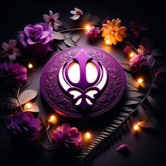 an illuminated purple object surrounded by flowers and leaves on a black background with fairy lights