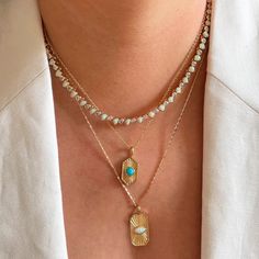 This unique piece features beautifully etched sun rays and a dazzling blue opal center. Perfect for adding a pop of color and radiance to any outfit. 14k gold plated brass 16 inch chain with 2 inch extender charm is 10 x 25mm lab created opal is 6mm Questions about Shipping & Returns? Tarnish Resistant Gold Opal Jewelry, Adjustable Gold Opal Jewelry, Gold Teardrop Opal Necklace, Gold Opal Teardrop Necklace, Elizabeth Stone, Hexagon Pendant, Radiant Diamond, Bag Icon, Icon Collection