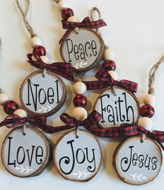 christmas ornaments made out of wood with the words noel, faith, love joy and peace