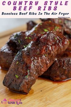 beef ribs in the air fryer on a cutting board with text overlay that reads country style beef ribs boneless beef ribs in the air fryer