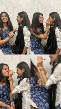 two girls are having their makeup done while another girl is brushing her teeth