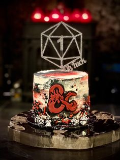 a red and white cake sitting on top of a table