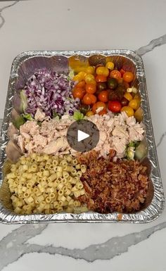 a metal tray filled with different types of food