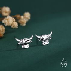 Delicate Highland Cow Stud Earrings in Sterling Silver, Silver or Gold or Rose Gold, Cute Bull Earrings, Cow Earrings, Scottish Design Sold as a pair.  Complete with sterling silver butterfly backs. Dimensions : 8mm  Materials and Care: These are made of sterling silver, the gold version coated with 18ct yellow gold. Only precious metals are used and they are hypoallergenic. They are tarnish resistant but please keep in a sealed plastic bag when not wearing.  Stamp: 925 SRS ( our brand initials Highland Cow Jewellery, Scottish Design, Cow Earrings, Cake Accessories, Fashion Revolution, Lost Wax Casting, Self Design, Delicate Earrings, Velvet Bag