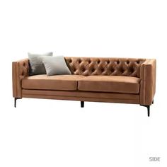 a brown leather couch with two pillows on it's back and the seat up