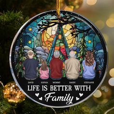 a stained glass ornament with the words life is better with family