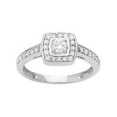 a white gold ring with diamonds on the sides and a square shaped diamond in the center