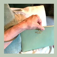 5" H X 8" W X 1-2" D - This Wristlet Is A Light Sage Green, Inside Has The The 2-Way Jacquard Lining. L-Zip Opens A Lot Of Area! Saffiano Leather, Genuine Calfskin That Has Been Treated To Get The Textured Crosshatch Look. This Helps It Stay Durable, Highly Scratch Resistant, Stain Resistant And Water Resistant. I Had To Google It. Gold Tone Hardware, Inside Has 4 Slots For Cc’s -Bc’s - Insurance- Dl- The Back Has A Zippered Pocket With A Gold Tone Pull That Says Kate Spade . I Got My Iphone 14 Kate Spade Zipper Pouch For Everyday Use, Kate Spade Everyday Zipper Pouch Bag, Kate Spade Rectangular Travel Clutch, Kate Spade Rectangular Clutch For Travel, Rectangular Kate Spade Clutch For Travel, Kate Spade Clutch For Everyday Use, Kate Spade Chic Clutch For Everyday Use, Chic Kate Spade Clutch For Everyday Use, Chic Kate Spade Clutch For Everyday