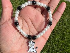 Are you a cow fan? You'll enjoy this white faux pearl bracelet with black glass beads. It also has a cute cow charm attached to it!  6mm pearl beads 8mm glass beads 7 inches Faux Pearl Bracelet, Glass Beaded Bracelets, Cute Cows, Polymer Clay Beads, Black Glass, Clay Beads, Pearl Bracelet, Pearl Beads, Arm Band