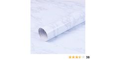 a roll of white marble paper sitting on top of a table