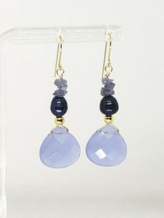 Beautiful Lavender Quartz Briolette Drop Dangle Earrings with natural royal blue freshwater pearls and genuine tanzanite chips.  DETAILS: Metal:               Ear wires are 14k Solid Yellow Gold, wire and round spacers are high quality 14k gold fill Style:                Drop / Dangle Length:             1.5" Sone Details: Lavender briolette: 12 mm, pearls are 5 mm, chips are 3 mm   Shipped with USPS First Class Package. We describe everything to the best of our knowledge, please look closely at Beads Craft Jewelry, Lavender Quartz, Beads Craft, Craft Jewelry, Drop Beads, Drop Dangle Earrings, Gold Wire, Fine Jewellery Earrings, Ear Jewelry