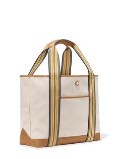 The Large Cabana Tote, perfectly oversized for beach and work trips, as an overnight bag, or as a companion for any journey, is a best seller that's sold out seven times and has a solid five-star ranking. It fits everything, it’s vibrant and stylish with its colorful stripes, and it’s sustainably crafted from our durable, spill-proof EcoCraft Canvas®, made from recycled plastic bottles. Make it yours by adding your initials below. Summer Weekender Bag With Leather Handles, Versatile Summer Canvas Travel Bag, Versatile Summer Travel Canvas Bag, Casual Beach Bag With Canvas Lining For Travel, Canvas Beach Bag With Removable Pouch For Travel, Canvas Beach Bag With Double Handle For Travel, Double Handle Canvas Beach Bag For Travel, Summer Travel Shoulder Bag With Canvas Lining, Summer Travel Weekender Bag In Beige