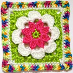 a crocheted square with a flower in the center