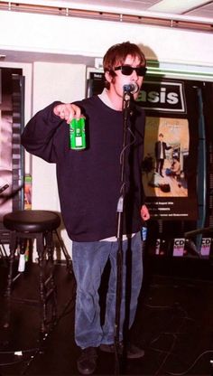 a man standing in front of a microphone