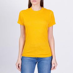 Vintage 80s plain yellow t shirt by Screen Stars in a cotton/poly blend, with a single stitch hem, and some light distressing. Unisex. Measurements and Condition:  Fits like: Labeled small, best fits modern men's XS and women's XS to small Fabric: Cotton/poly Brand: Screen Stars, made in USA Condition: Good, with some small faint blue color bleed spots throughout the front, three pinpoint holes on the right chest, and a 1/4" and two tiny holes on the upper front right by the collar. Length: 25.5 Plain Yellow T Shirt, Star T Shirt, Yellow T Shirt, Modern Man, Vintage Tshirts, Womens Clothing Tops, Models, Blue Color, T Shirts For Women