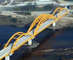 an aerial view of a yellow and white bridge