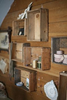 a wooden wall with many different types of items on it's sides and shelves