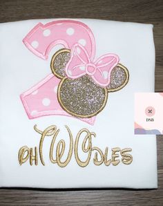 a pink and gold minnie mouse birthday shirt with the number one on it's chest