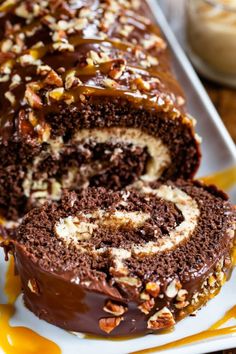 there is a chocolate roll with nuts on it