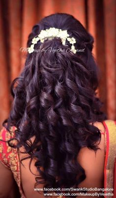 the back of a woman's head with curly hair