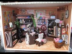 a doll house with furniture and accessories in it