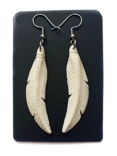 PRICES MAY VARY. These Bone Earrings feature a beautiful bone feather hand carved out of ox bone wonderful detail. Unique! Earrings Material: Ox Bone Earring Length (with Hook): 2.4 inch (60mm) Earring Size: 1.6 x 0.4 inch (40mm x 10mm) Hook Type: French Hook These Bone Earrings feature a beautiful bone feather hand carved out of ox bone wonderful detail. Unique! Witchy Business, Deer Antler Jewelry, Feather Fashion, Antler Jewelry, Bone Earrings, Bone Jewelry, Earrings Handmade Dangle, Carved Bone, Bone Carving