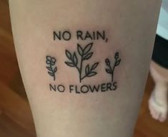 a woman's leg with a tattoo saying no rain, no flowers