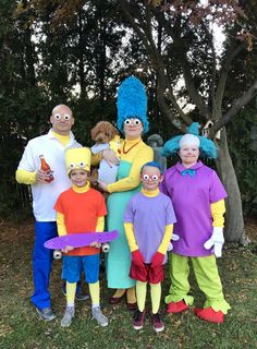 a group of people in costumes standing next to each other