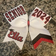 Senior bow in layered text. Senior and any year on upper loops. Bow is fully customizable. Great senior night bow. Cowbell Decorations, Cheer Spirit Sticks, Softball Hair Bows, Custom Cheer Bows, Cheer Spirit, Cheerleading Bows, Softball Hairstyles, Cheer Gifts, Senior Night