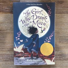 the girl who drank the moon by kelly barnhill is on display at the children's book store