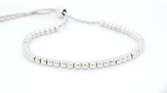 "This is a trendy, silver beaded bracelet with 2mm beads. It is perfect for everyday wear. It looks great with any outfit and is great in a stack. Unlike most beaded bracelets, ours is adjustable and more durable.  We also carry the same bracelet in 4mm beads, if you want to add texture to your stack.  Metal: Silver Bead Width: 2mm Adjustable: Yes To discover more rings from my collection, please click on the link below : https://www.etsy.com/shop/EderraFineJewelry?ref=hdr_user_menu-shop ABOUT Ederra | Release Your Inner Goddess Gold is one of the oldest metals on this planet. It symbolizes humankind's journey to illuminate and refine oneself. It exerts positive energy and clarity to help you get to the ultimate level of euphoria. Welcome to Ederrá, where each piece is made with love. Brow Adjustable Stackable Silver Stretch Bracelet, Adjustable Nickel-free Silver Beaded Bracelets, Adjustable Multi-strand Silver Beaded Bracelets, Adjustable White Stretch Bracelet, Nickel Free, Nickel-free Sterling Silver Bracelet With Round Beads, Dainty Diamond Ring, Sterling Silver Bead Bracelet, Gold Rings Stackable, Adjustable Jewelry