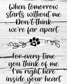 a wooden sign that says when tomorrow starts without me don't think we're far apart for every time you think of me inside your heart