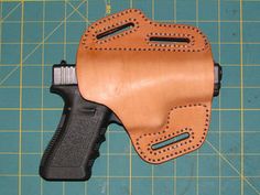 In this instructable, I'll show you how I made a nice leather holster and formed it to fit my pistol perfectly. This holster was designed for a Glock 17, but the... Leather Paddle, Leather Knife Sheath Pattern, Laser Cut Leather, Target Practice