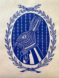 a blue and white drawing of a rabbit