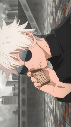 an anime character holding a cell phone in his hand and pointing it at the camera