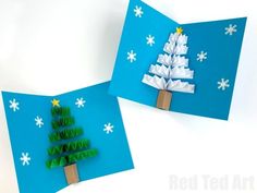 two folded christmas cards with paper trees on them