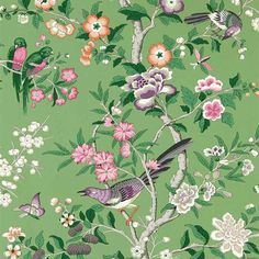 a green wallpaper with birds and flowers on it