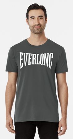 a man wearing a grey t - shirt with the word everlong in white on it