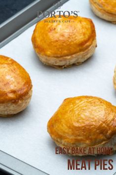 several baked pastries sitting on top of a baking sheet with the words easy bake at home meat pies