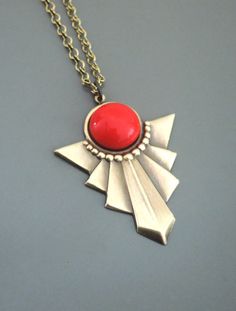 "Vintage Jewelry - Art Deco Necklace - Red Necklace - Vintage Necklace - Pendant Necklace - handmade jewelry This is such a cool! vintage necklace! An Art Deco design pendant embellished with a bright red glass cabochon. The pendant hangs from a pretty vintage brass ladder chain. Chloe says, \"Wear it and feel fabulous!\" This pendant is 1 3/4\" long. You can choose the length you would like at checkout. Thanks for visiting Chloe's" Retro Metal Jewelry For Gifts, Retro Metal Jewelry For Gift, Red Metal Necklace With Large Pendant, Handmade Red Pendant Jewelry, Red Bohemian Round Pendant Jewelry, Unique Handmade Red Necklace, Artistic Red Pendant Jewelry, Vintage Red Round Pendant Jewelry, Red Large Pendant Jewelry For Gift